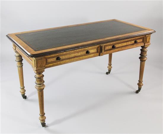 A Victorian birds eye maple and walnut two drawer writing table, W.4ft 5.5in.